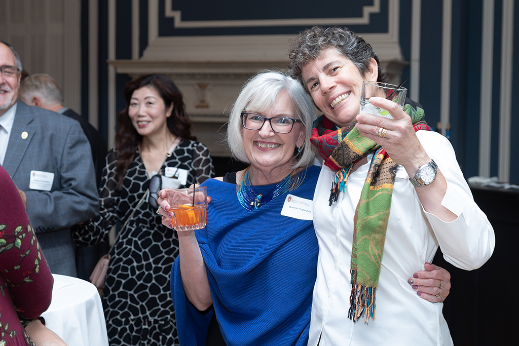 UW School of Pharmacy 2022 Citations of Merit Dinner & Awards Bonnie Fingerhut and Susan Stein smile while hugging.