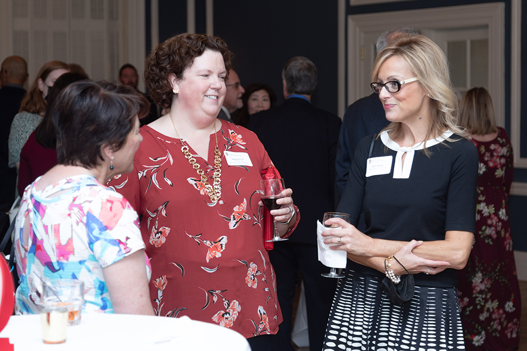 UW School of Pharmacy 2022 Citations of Merit Dinner & Awards Sarah Sorum and Beth Martin speak with another attendee of the Citations of Merit event.