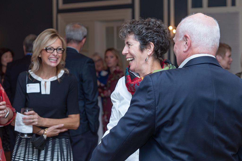 UW School of Pharmacy 2022 Citations of Merit Dinner & Awards A candid photo of Susan Stein laughing with Beth Martin smiling in the background.