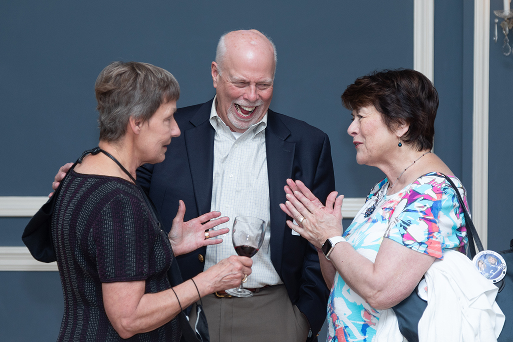 UW School of Pharmacy 2022 Citations of Merit Dinner & Awards Christine Sorkness visits with Bill Mellon and another attendee of the Citations of Merit.