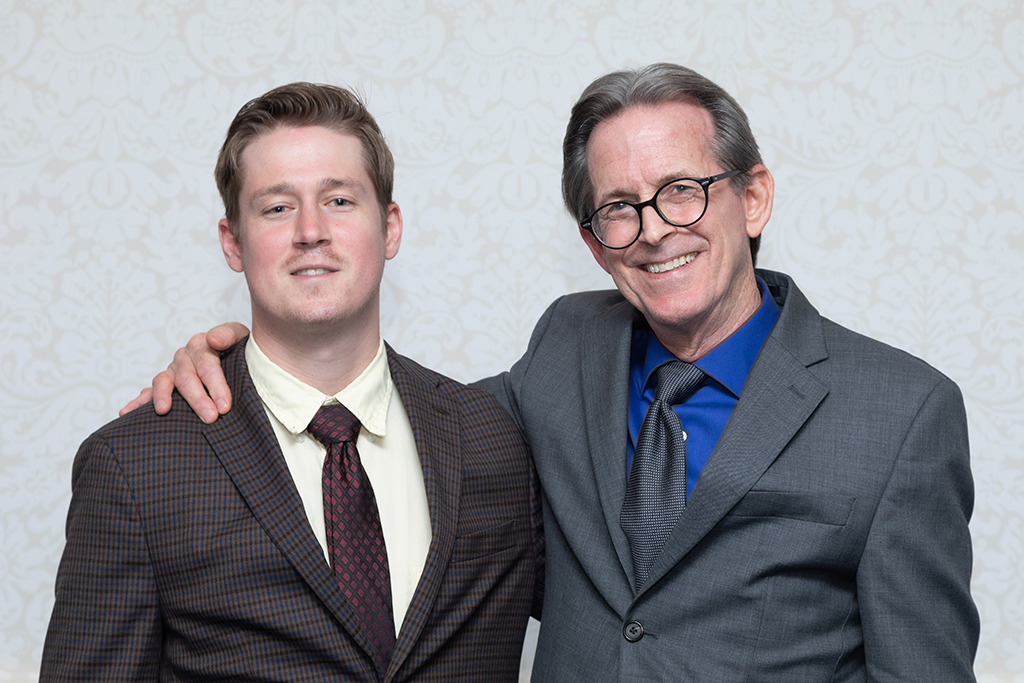 UW School of Pharmacy 2022 Citations of Merit Dinner & Awards John Swann smiles with his arm around his son.