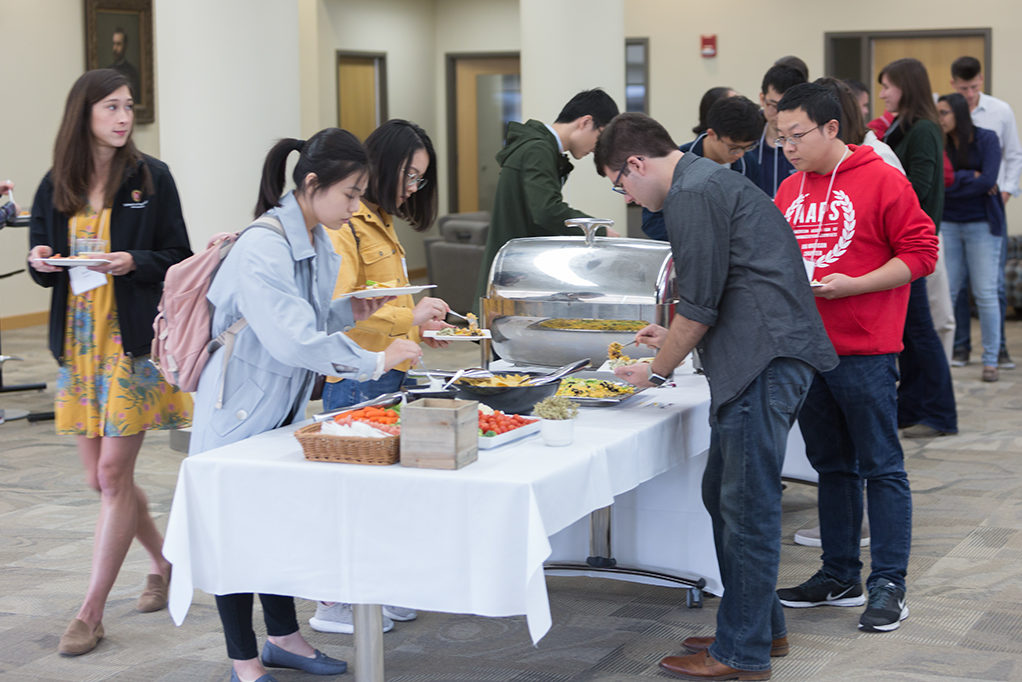 phar092118_006 Students getting food from buffet table