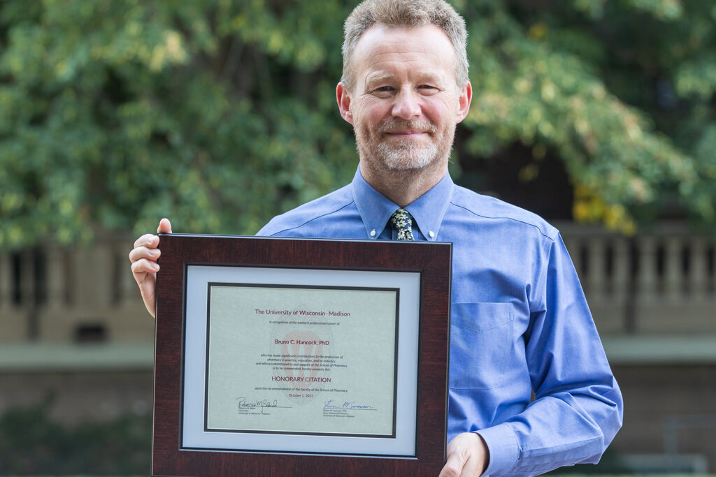 Bruno Hancock holding his Citation of Merit award