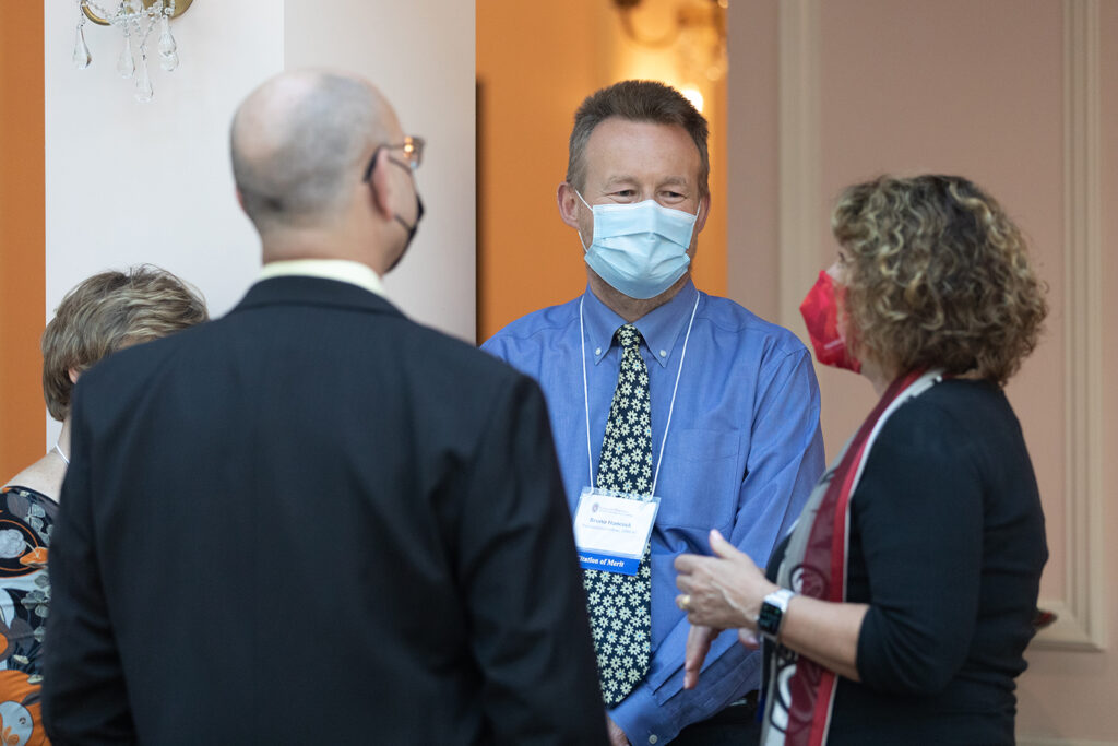 School of Pharmacy Citations of Merit Awards 2021 Pharm Alumni talking together at event