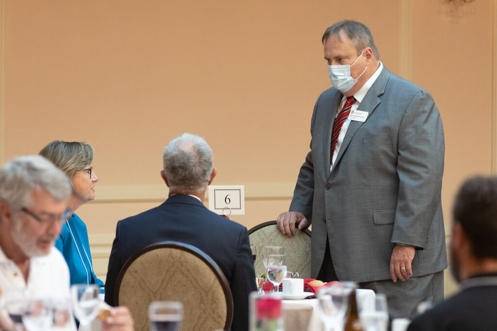 School of Pharmacy Citations of Merit Awards 2021 Steve Swanson talking to event attendees
