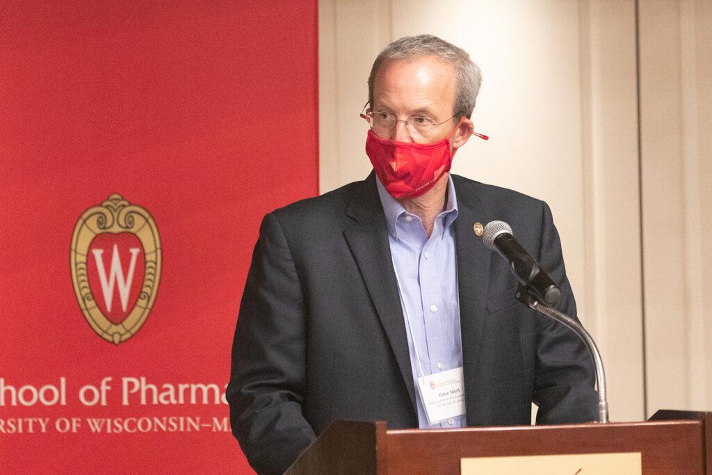 Dave Mott speaking at the podium