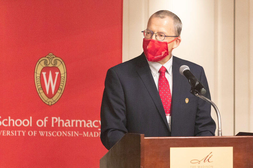 Bill Doucette speaking at the podium