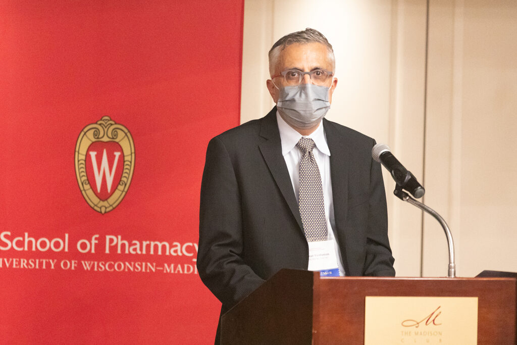 Mehran Yazdanian speaking at the podium