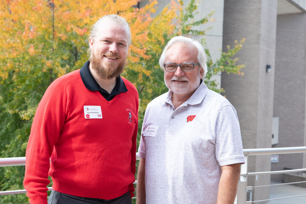 School of Pharmacy Alumni Tailgate Party 2021 Jeffrey Johnson smiling with Kyle Kleinbeck