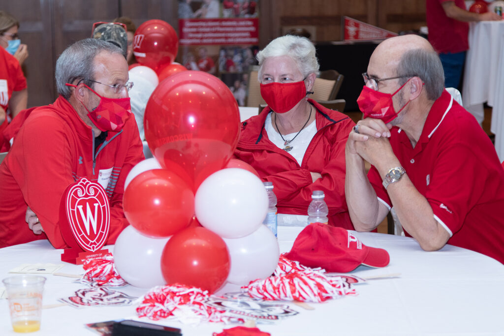 School of Pharmacy Alumni Tailgate Party 2021 Dave Mott and other event coordinators together at a table