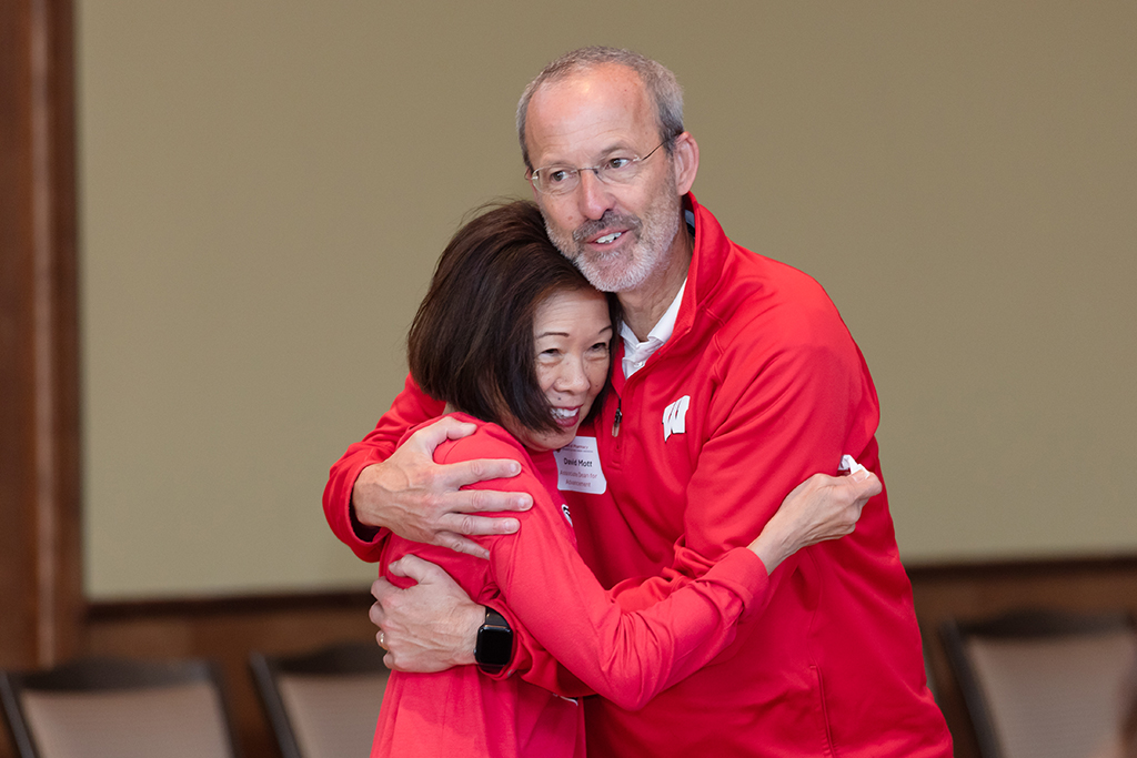 UW–Madison School of Pharmacy 2024 Alumni Tailgate and Watch Party Pauline Chan and Dave Mott hug