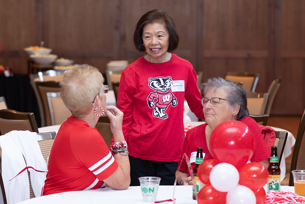 UW–Madison School of Pharmacy 2024 Alumni Tailgate and Watch Party Pauline Chan speaks with Mary Anne Kennedy and Valerie Schend