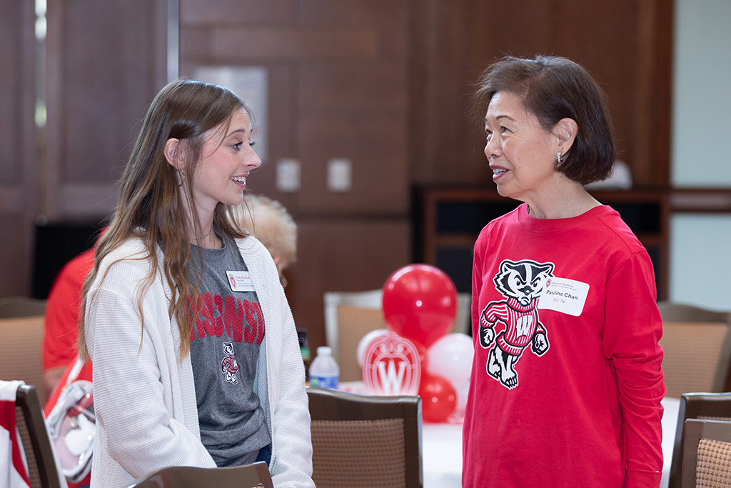 UW–Madison School of Pharmacy 2024 Alumni Tailgate and Watch Party Pauline Chan speaks with PharmD student Kalista Paszczak