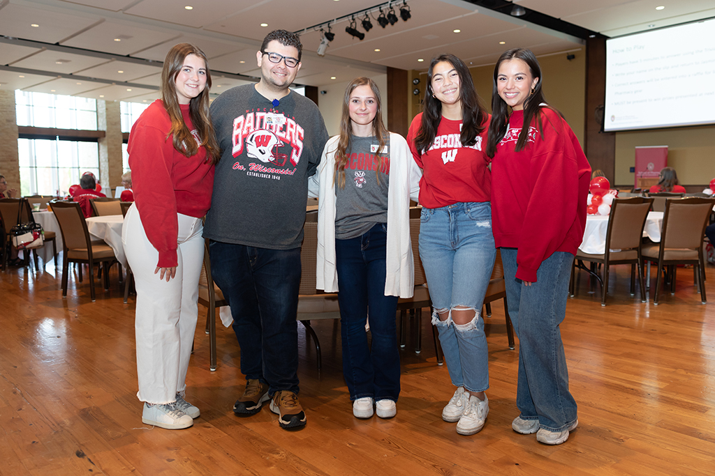 UW–Madison School of Pharmacy 2024 Alumni Tailgate and Watch Party PharmD students pose for a photo, including Kalista Paszczak and Joey Jimenez