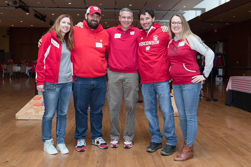 School of Pharmacy Alumni Tailgate Party 2023 Five alumni smiling together for group photo