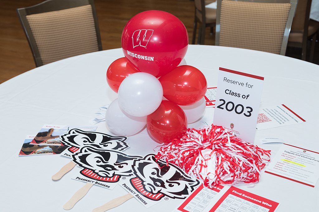 School of Pharmacy Alumni Tailgate Party 2023 Table with balloons and props labelled "Reserve for Class of 2003"