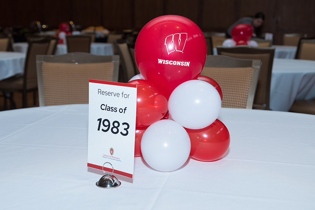 School of Pharmacy Alumni Tailgate Party 2023 Table with balloons and sign reading "Reserve for Class of 1983"