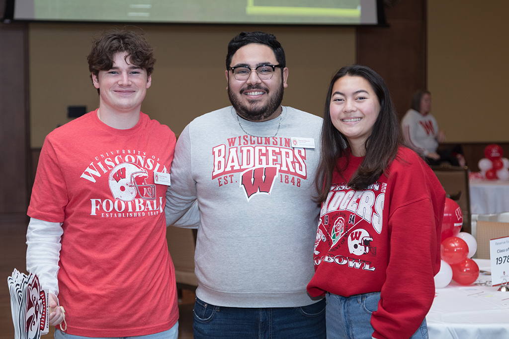 School of Pharmacy Alumni Tailgate Party 2023 Event coordinators wearing badger gear together