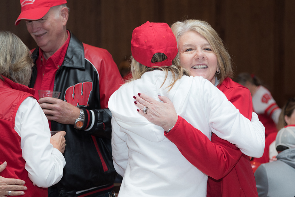 School of Pharmacy Alumni Tailgate Party 2023 Alumni hugging
