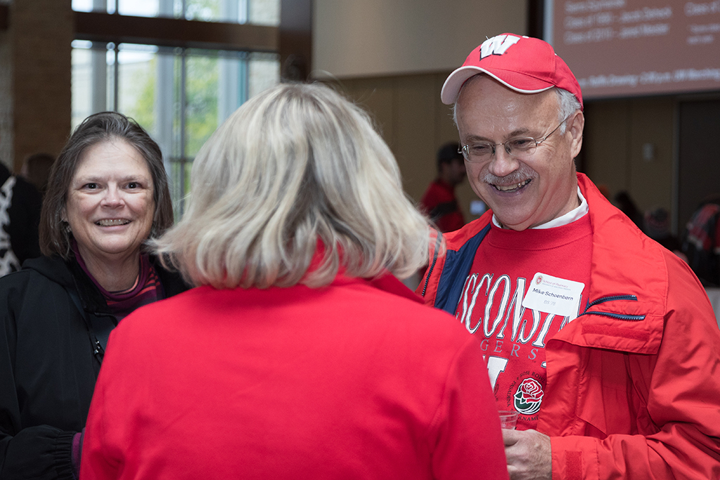 School of Pharmacy Alumni Tailgate Party 2023 Alumni laughing