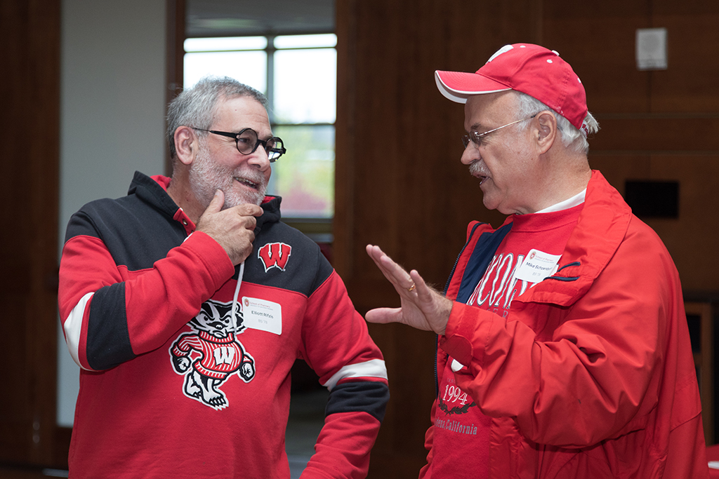 School of Pharmacy Alumni Tailgate Party 2023 Two alumni in a conversation