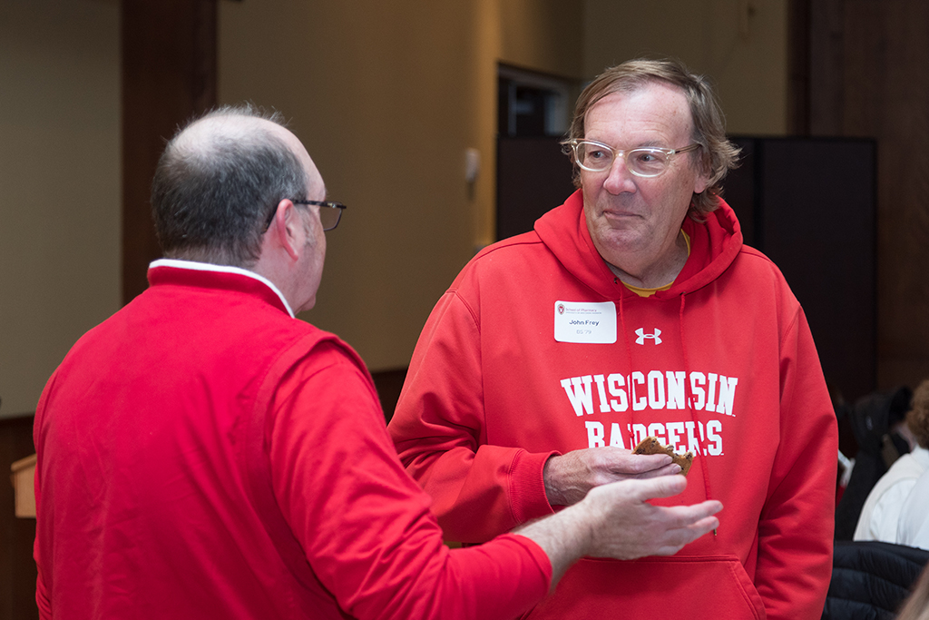 School of Pharmacy Alumni Tailgate Party 2023 Ed Elder speaking with John Frey