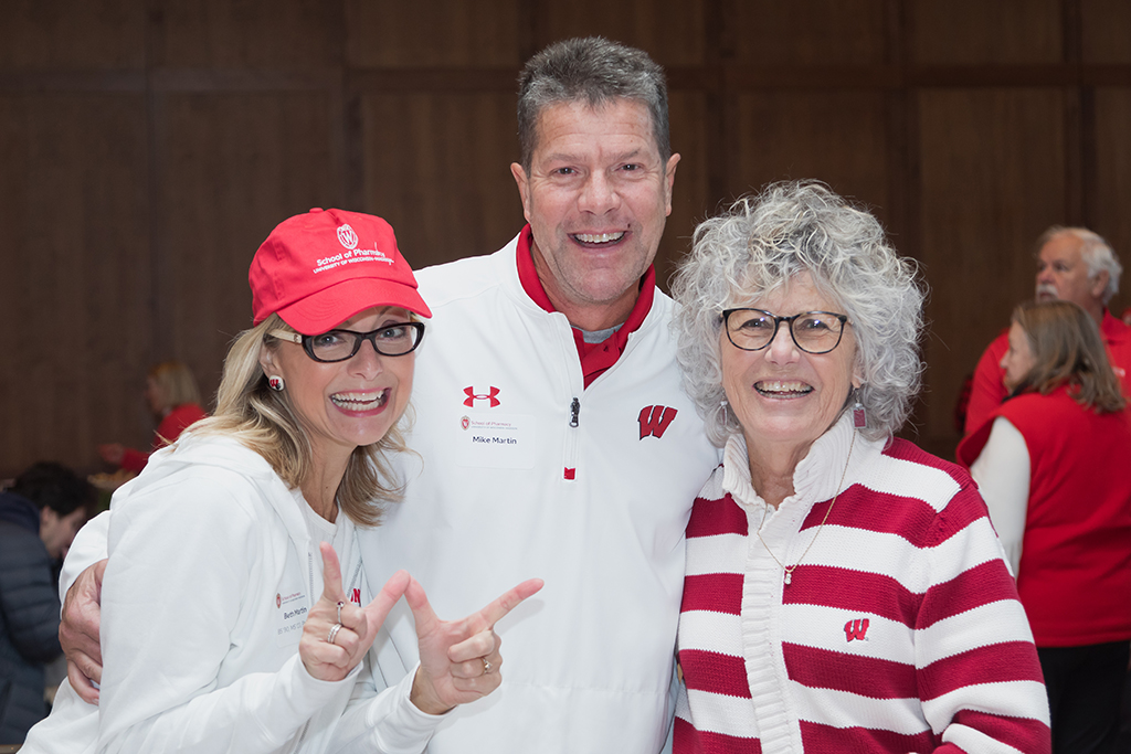 School of Pharmacy Alumni Tailgate Party 2023 Beth Martin together with her husband and mother at tailgate party