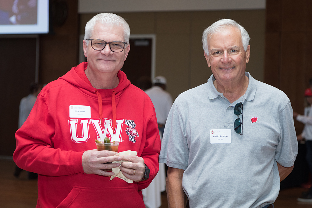 School of Pharmacy Alumni Tailgate Party 2023 Two alumni smiling for the camera