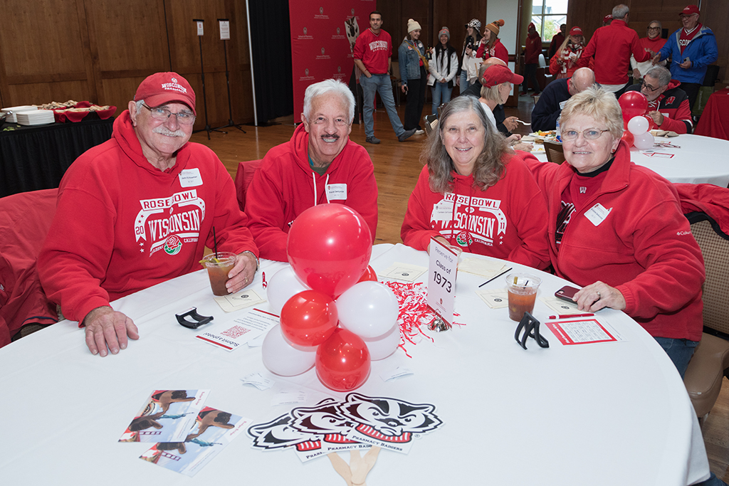 School of Pharmacy Alumni Tailgate Party 2023 Alumni Class of 1973 sitting around table