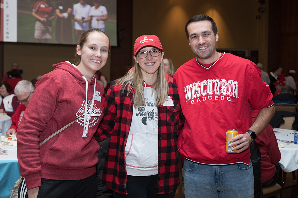 School of Pharmacy Alumni Tailgate Party 2023 Alumni together smiling for camera