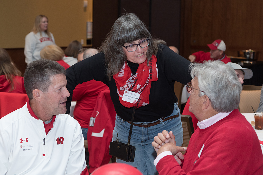 School of Pharmacy Alumni Tailgate Party 2023 Alumni talking together