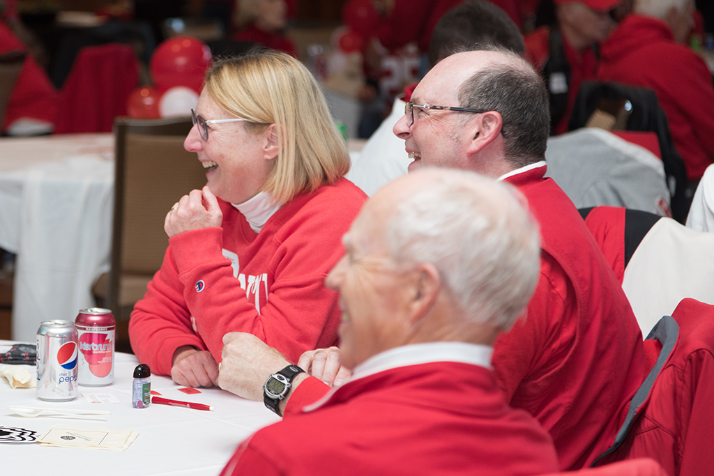 School of Pharmacy Alumni Tailgate Party 2023 Tailgate attendees laughing around table