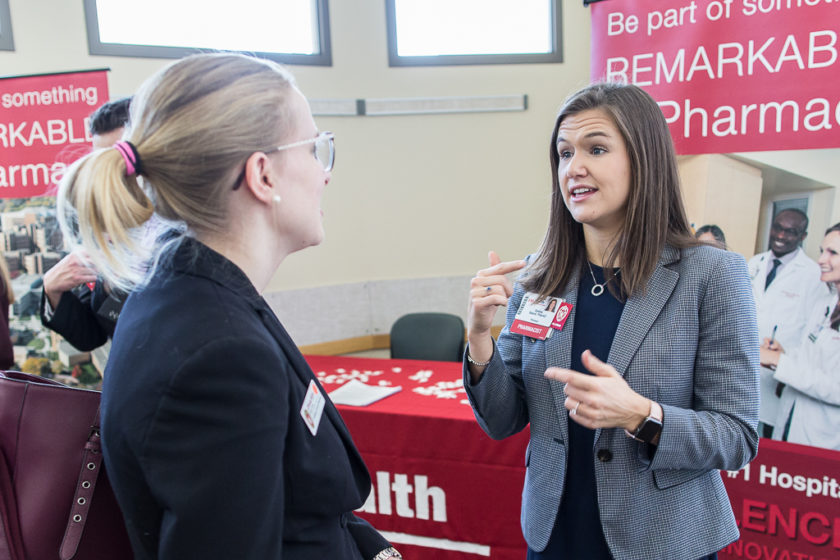 Student speaking to staff at Career development day