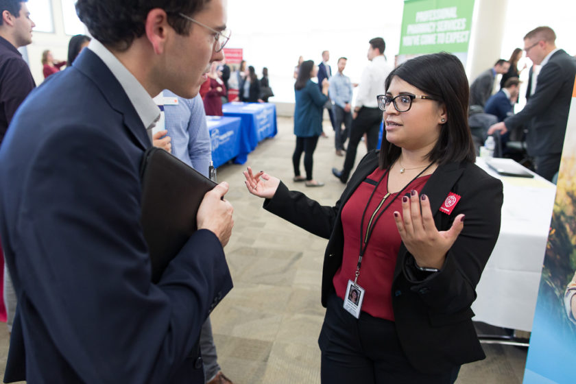 Student speaking to staff at Career development day