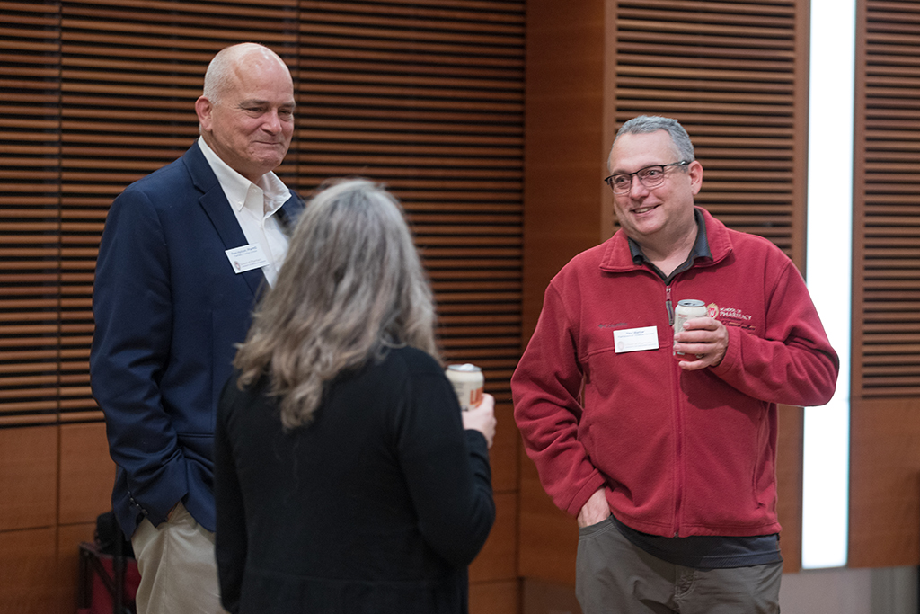 UW–Madison School of Pharmacy Board of Visitors Meeting 2022 Paul Hutson and Paul Marker speak with another attendee