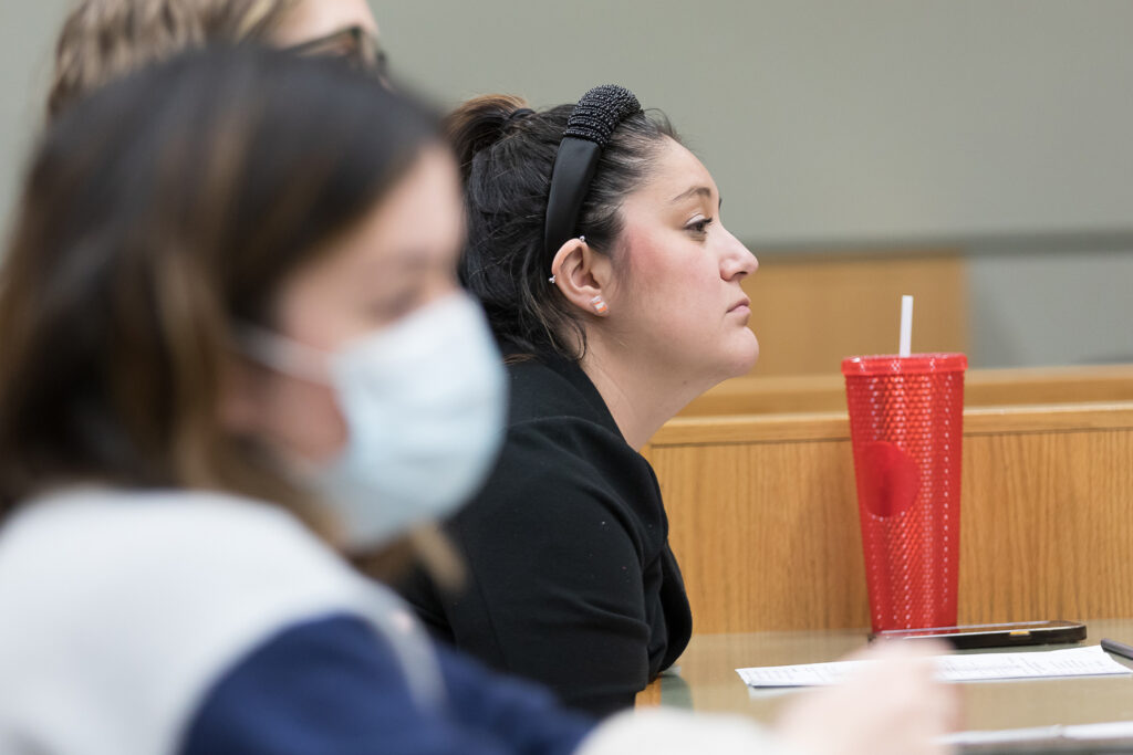 SoP Lecture: Cultivating Belonging in Pharmacy (December 1, 2023) Assistant Professor Marina Maes listens to the keynote speech during the DiveRxsity Dialogues event.