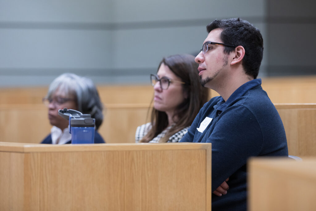 SoP Lecture: Cultivating Belonging in Pharmacy (December 1, 2023) Professor Eva Vivian, Associate Dean for Diversity and Inclusion Initiatives Lisa Imhoff, and Associate Professor Ed Portillo listen to the keynote speech at the DiveRxsity Dialogues event.