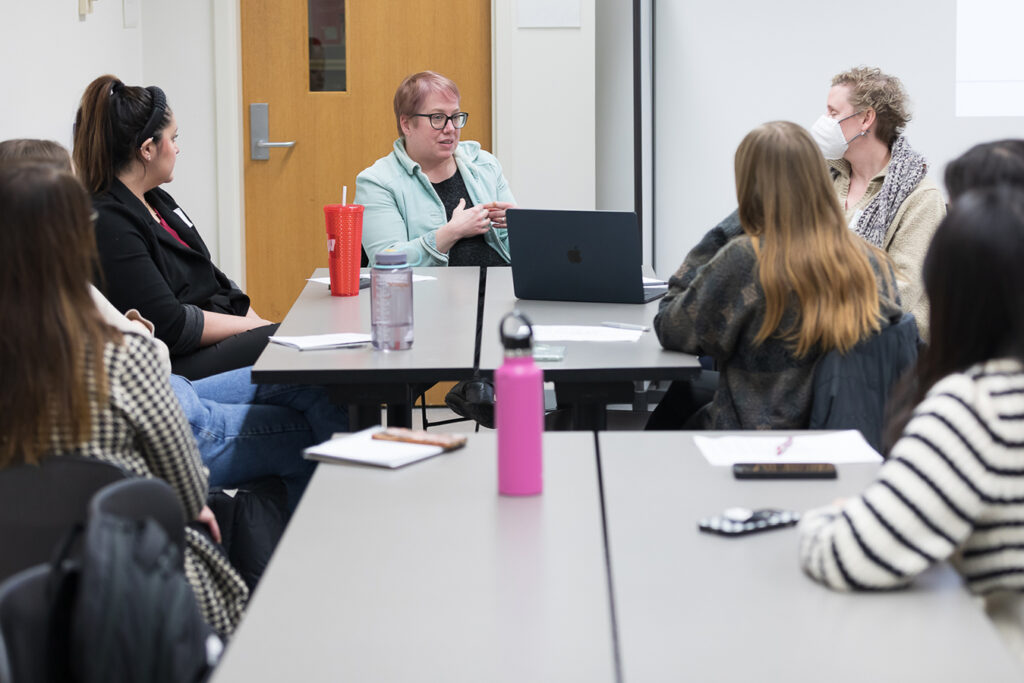 SoP Lecture: Cultivating Belonging in Pharmacy (December 1, 2023) Erika Enk, nurse case manager with University Health Services, speaks during the DiveRxsity Dialogues event.