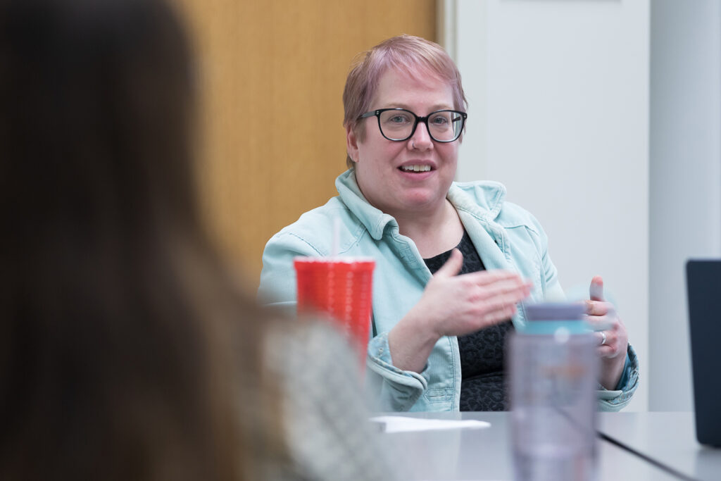 SoP Lecture: Cultivating Belonging in Pharmacy (December 1, 2023) Erika Enk, nurse case manager with University Health Services, speaks during the DiveRxsity Dialogues event.