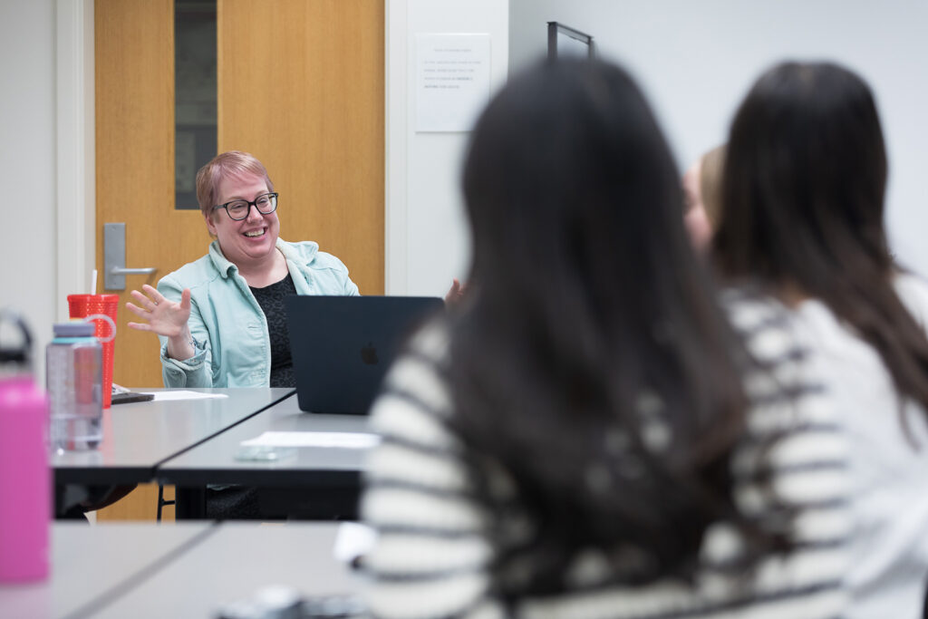 SoP Lecture: Cultivating Belonging in Pharmacy (December 1, 2023) Erika Enk, nurse case manager with University Health Services, speaks during the DiveRxsity Dialogues event.