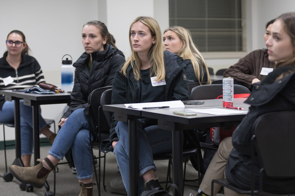 SoP Lecture: Cultivating Belonging in Pharmacy (December 1, 2023) PharmD students watch a presentation during the DiveRxsity Dialogues event.