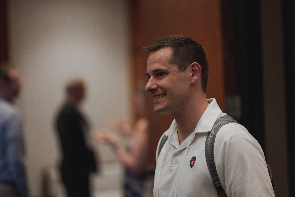 pharma0004_ A male attendee smiles