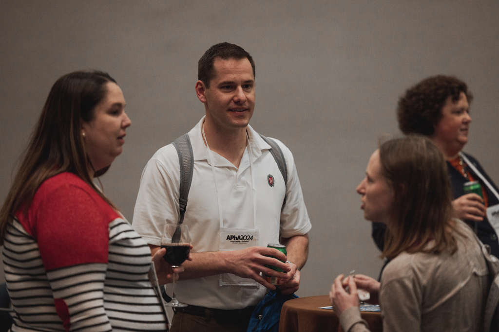 pharma0072_ A man listens while two women speak