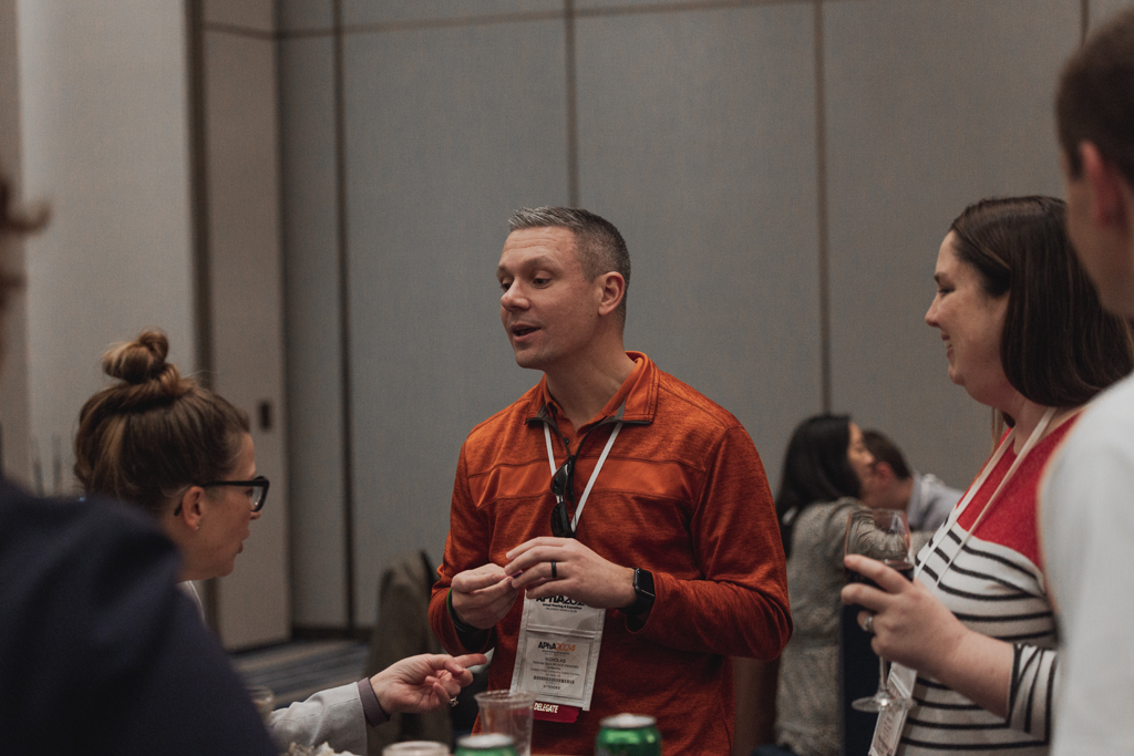 pharma0105_ Nick Olson speaks with others