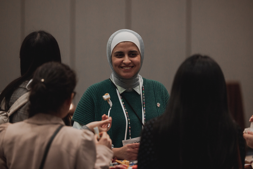 pharma0124_ Sura AlMahasis speaks with other attendees