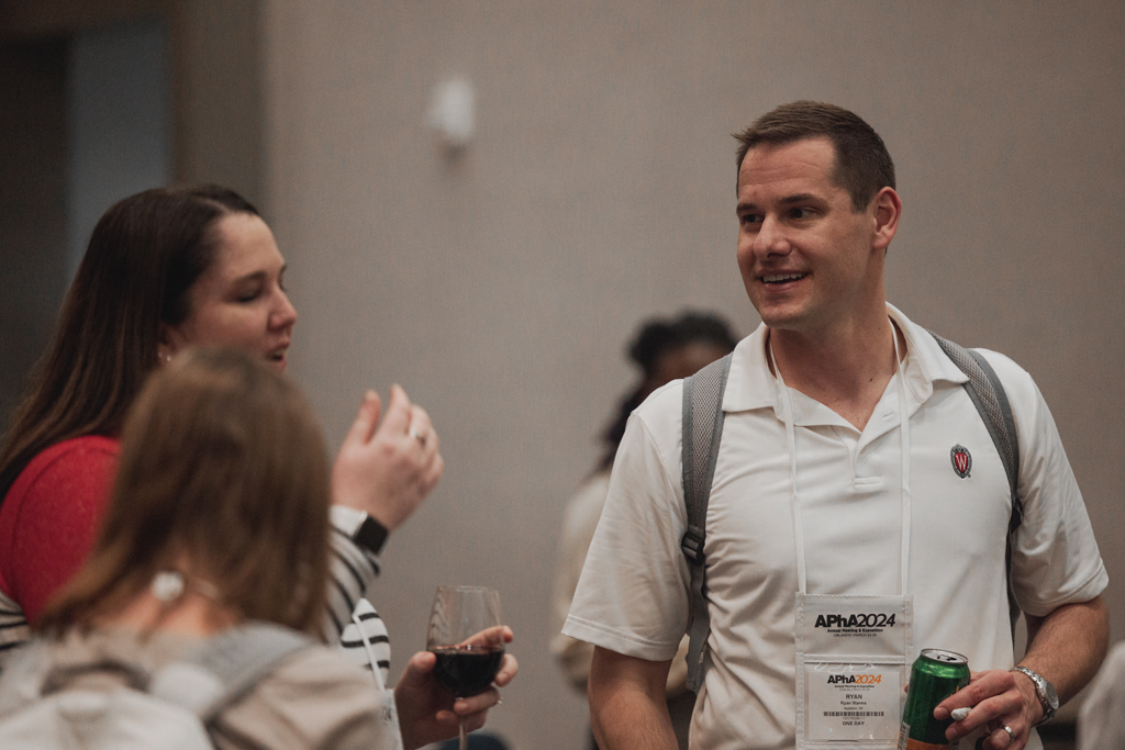 pharma0173_ An attendee named Ryan speaks with others