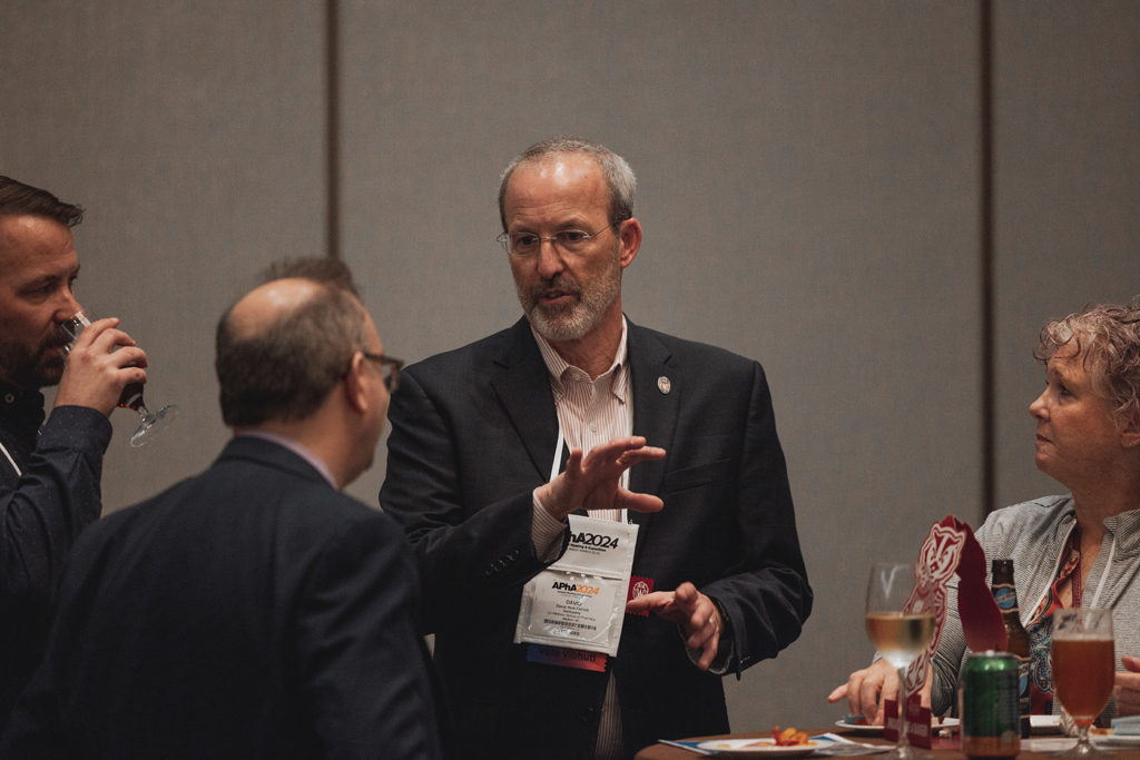 pharma0177_ Dave Mott speaks with attendees