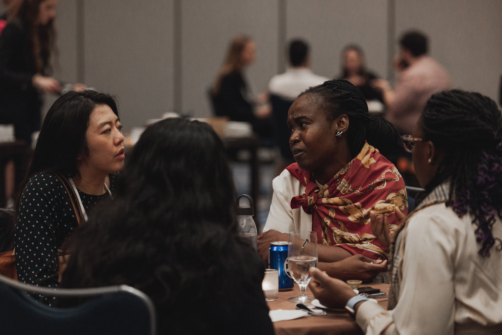 pharma0366_ Jenny Li and Adati Tarfa chat with a group