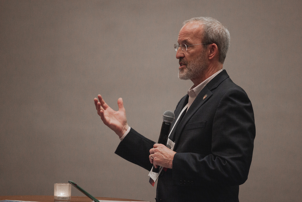 pharma0466_ Dave Mott speaks with a microphone