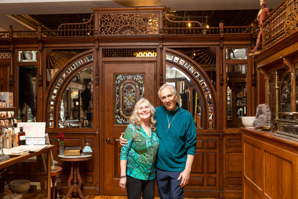real-life-photographs-08 Nancy Losinski Haggar with her husband, Curt, near the ornate wooden entrance to their historical collection.